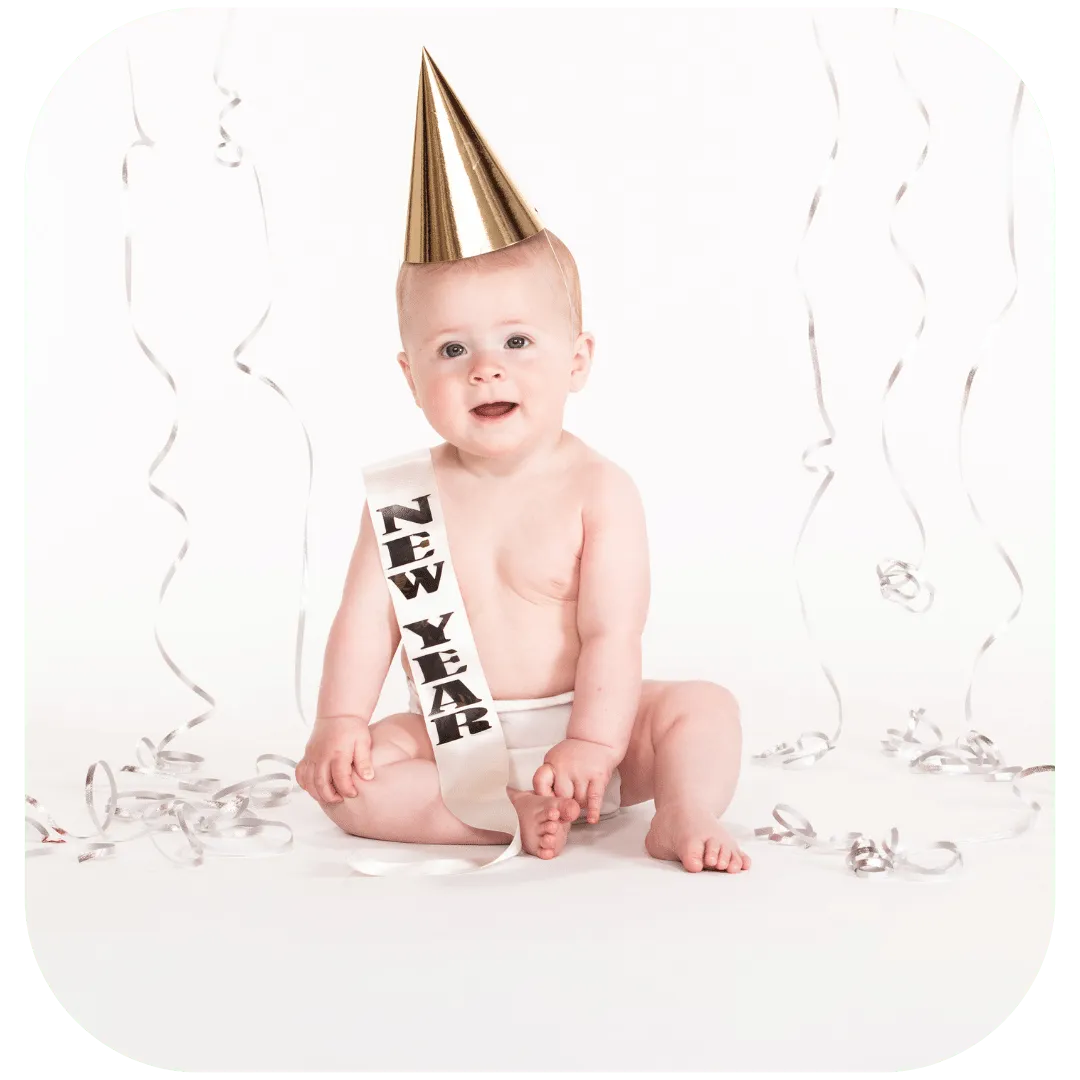 1 year old with New Year banner for a New Year birthday party