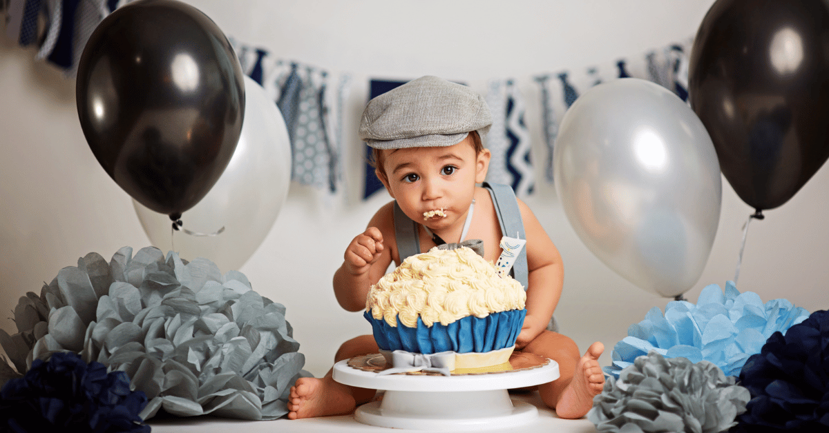 1 year old boy enjoying a smash cake